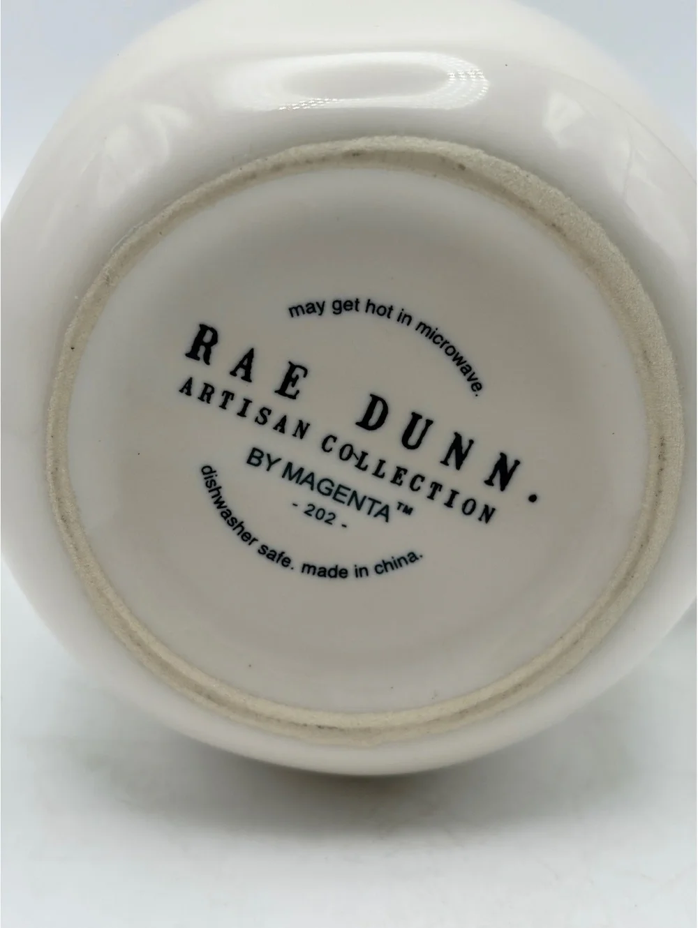 Rae Dunn white ceramic syrup pitcher.with handle. In like new condition